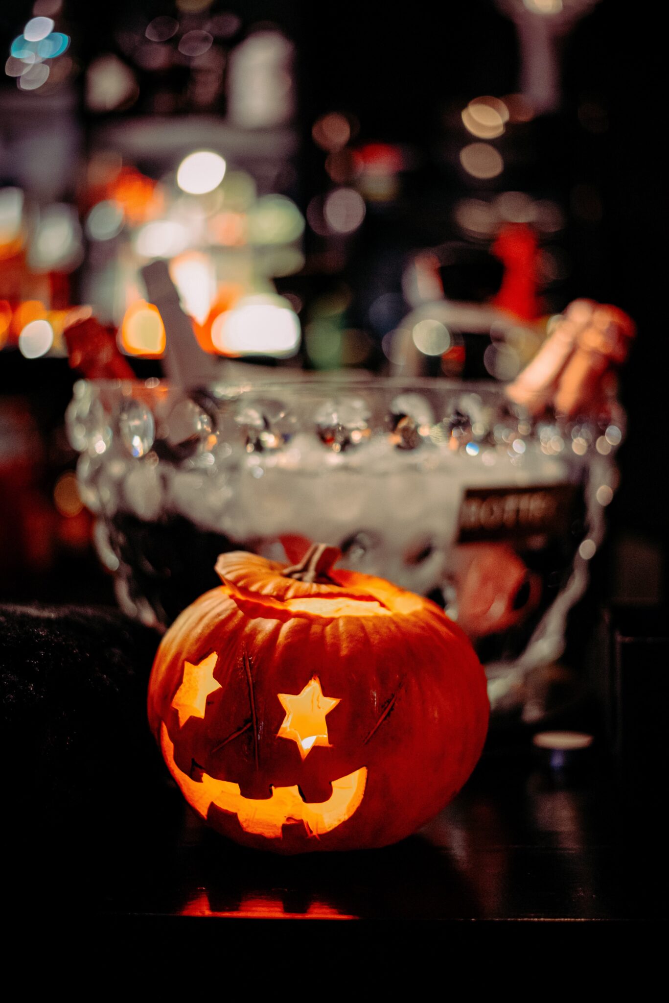 Pumpkin decoration sat infront of bowl of punch, set up by the best bar hire Colchester can offer